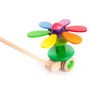 Jouet à pousser Fleur Arc-en-ciel en bois BAJO avec pétales multicolores tournants et manche en bois pour enfant dès 18 mois.